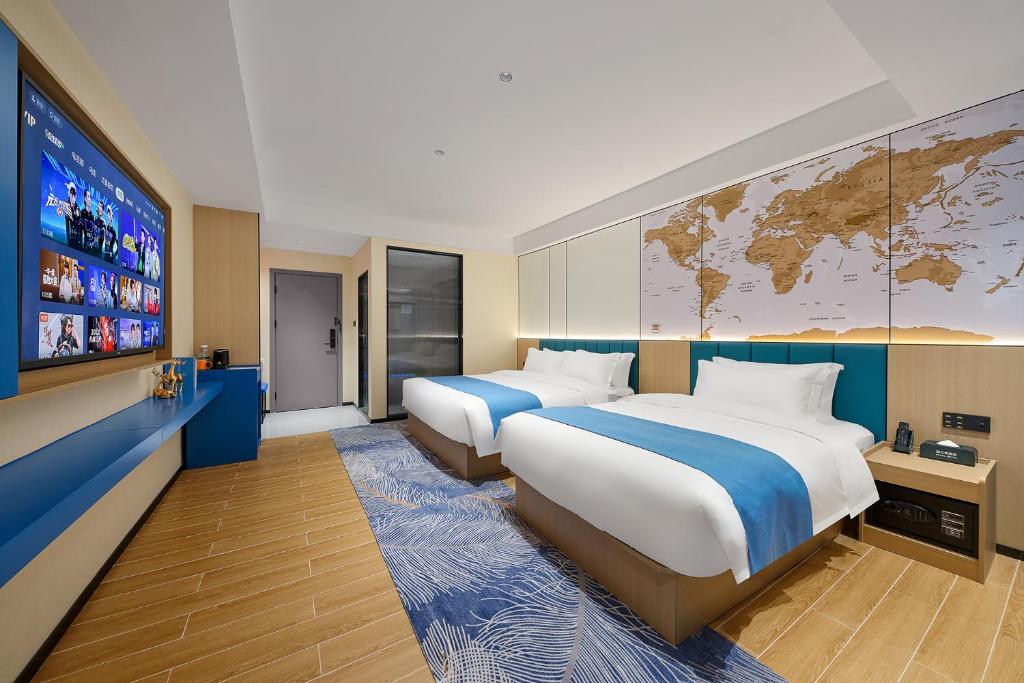 Postel nebo postele na pokoji v ubytování Pearl Hotel - Gongbei Port Zhuhai