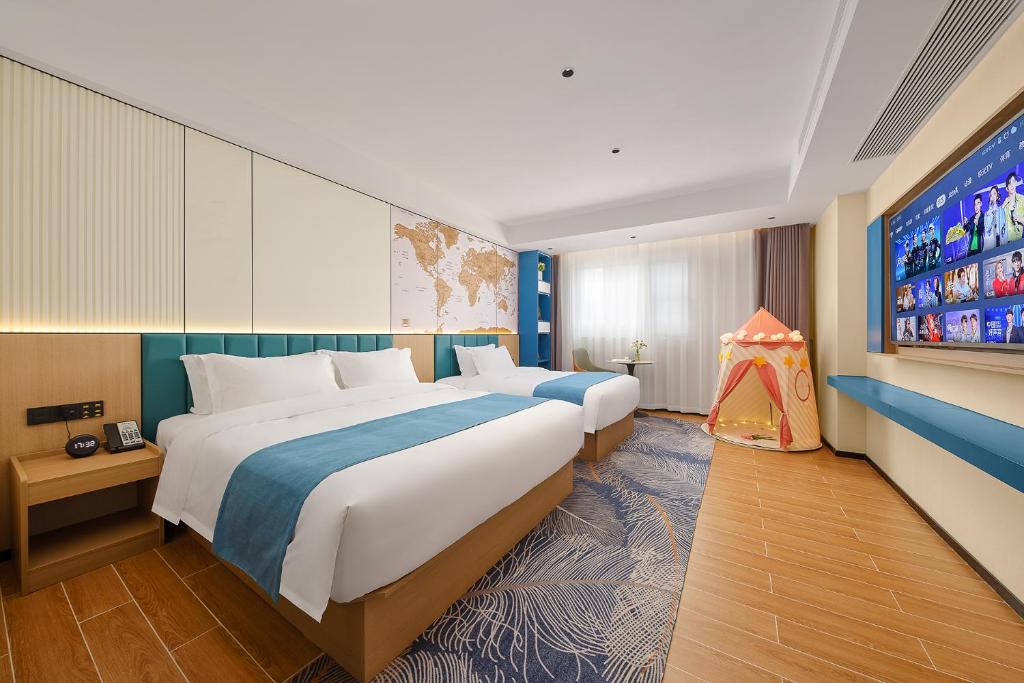 Postel nebo postele na pokoji v ubytování Pearl Hotel - Gongbei Port Zhuhai