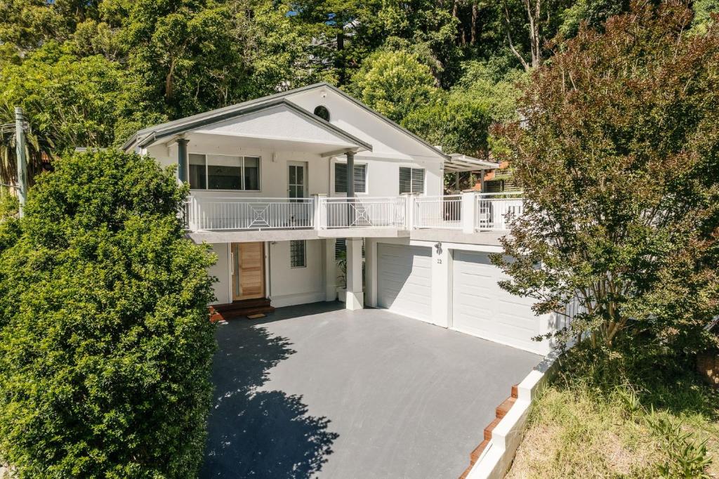 an aerial view of a house with a garage at Beach Vibe at Terrigal in Terrigal