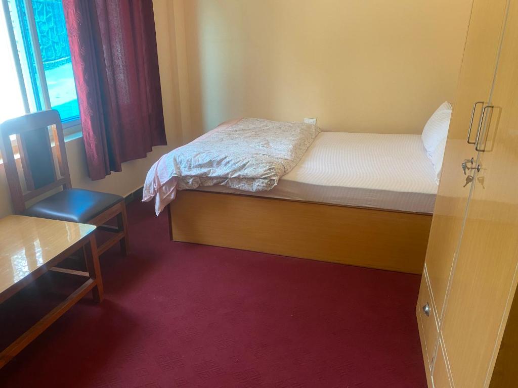 Letto o letti in una camera di Prashiddha Resort