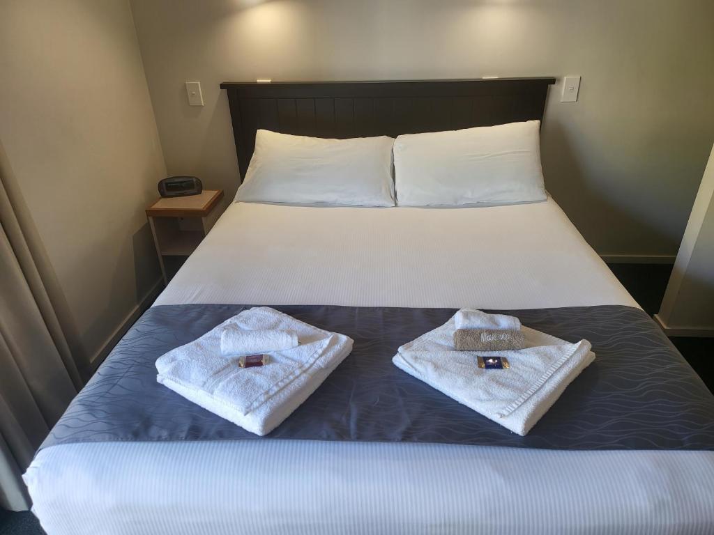 Postel nebo postele na pokoji v ubytování Ferrylink Motel