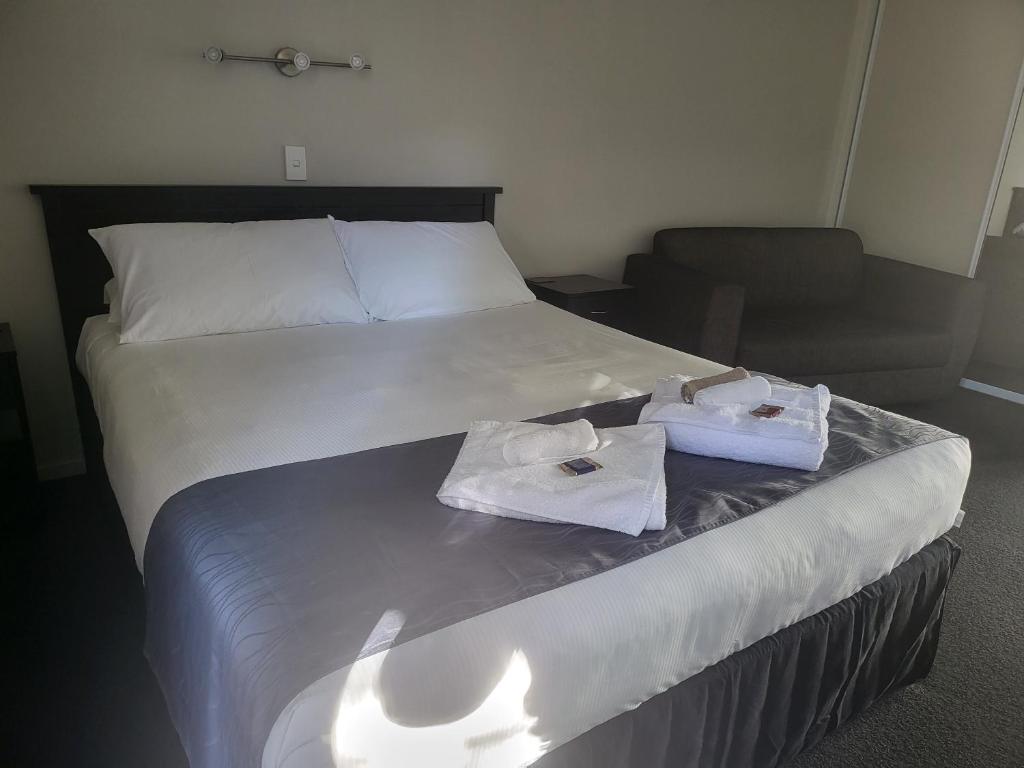 Postel nebo postele na pokoji v ubytování Ferrylink Motel