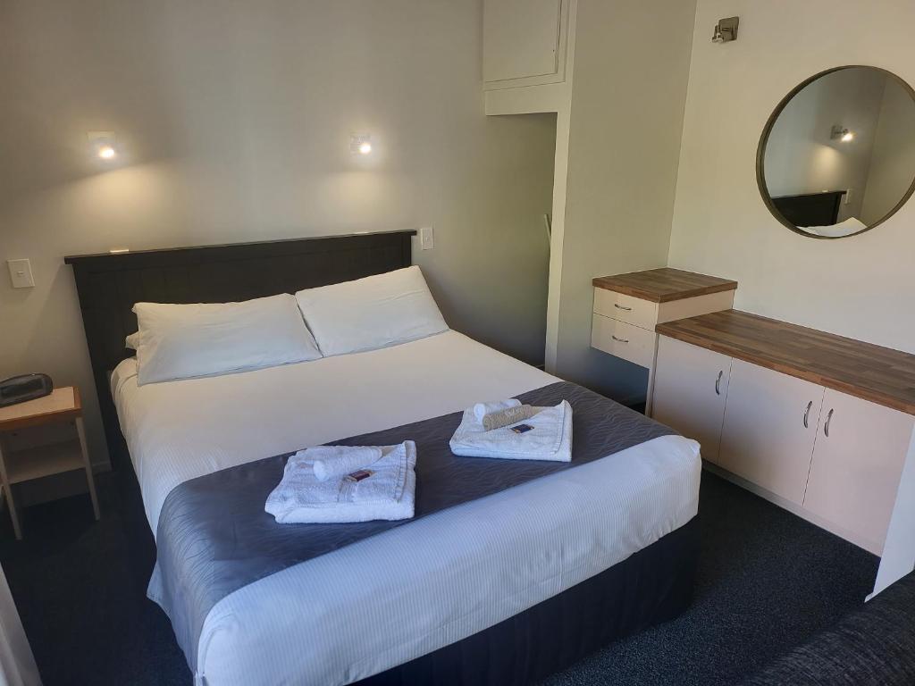 Postel nebo postele na pokoji v ubytování Ferrylink Motel