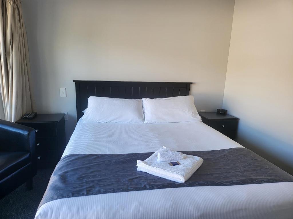 Postel nebo postele na pokoji v ubytování Ferrylink Motel