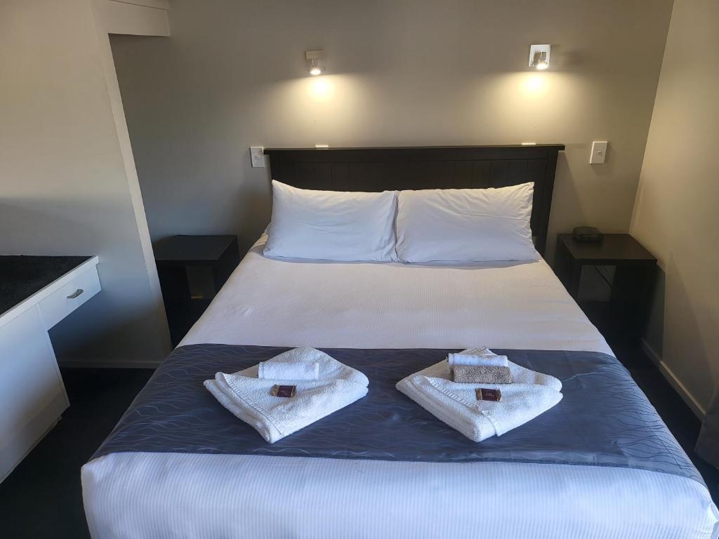 Postel nebo postele na pokoji v ubytování Ferrylink Motel