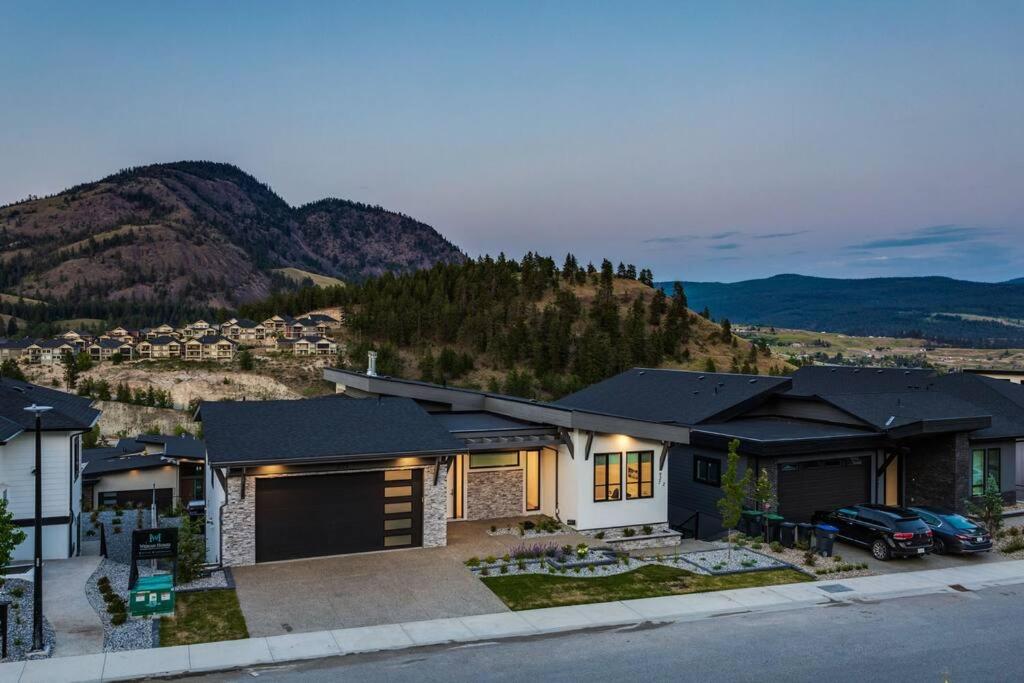 a house with a view of a mountain at Luxury Golf Stay w/Hot Tub in Kelowna