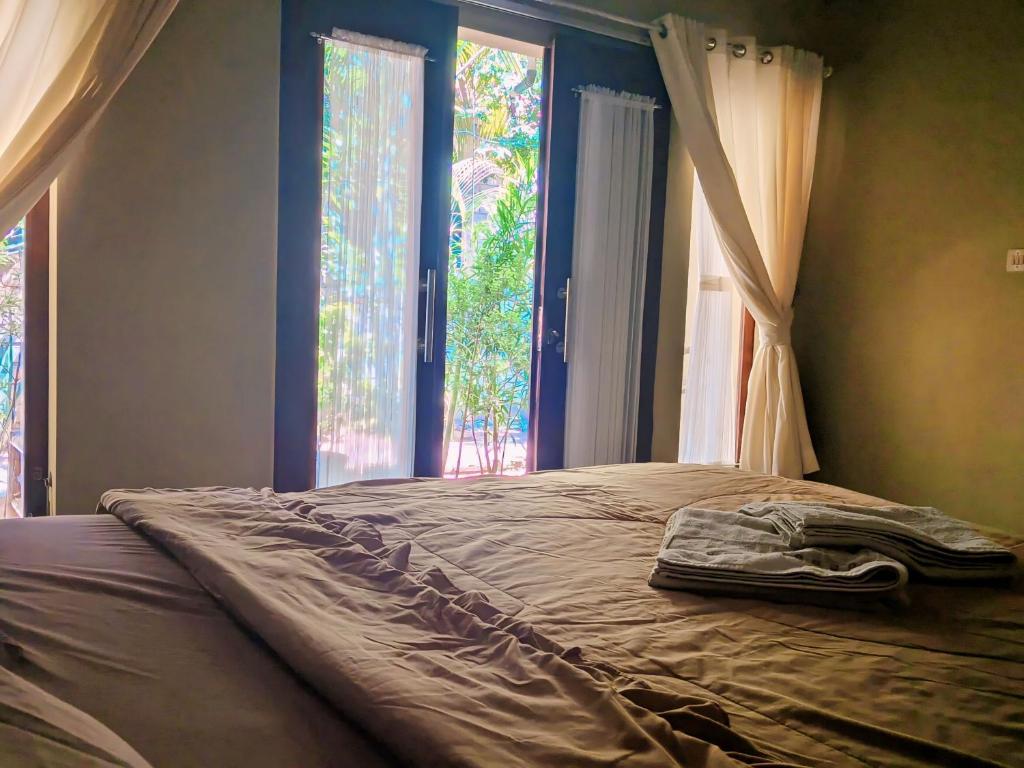 Voodi või voodid majutusasutuse Three V Homestay toas