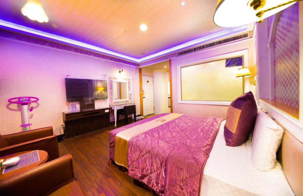 Postel nebo postele na pokoji v ubytování Wen Sha Bao Motel-Xinying