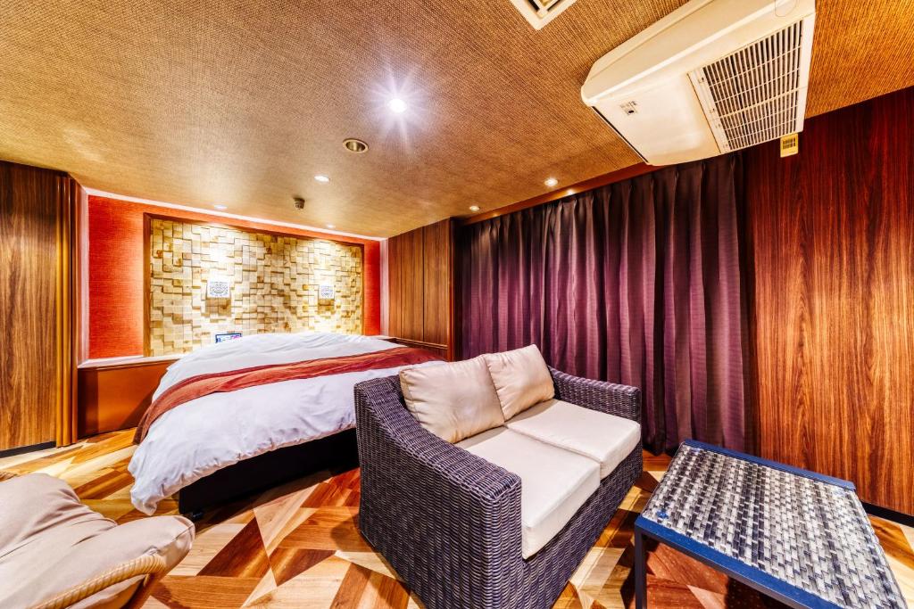 Postel nebo postele na pokoji v ubytování Hotel Lotus Ibaraki -Adult Only