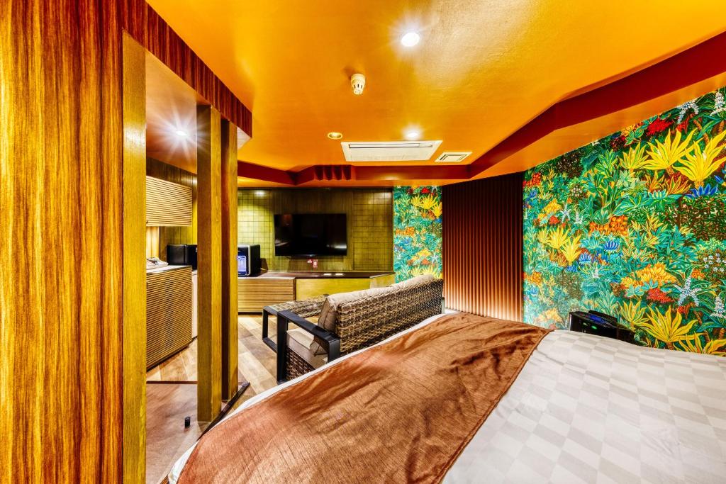 Postel nebo postele na pokoji v ubytování Hotel Lotus Ibaraki -Adult Only