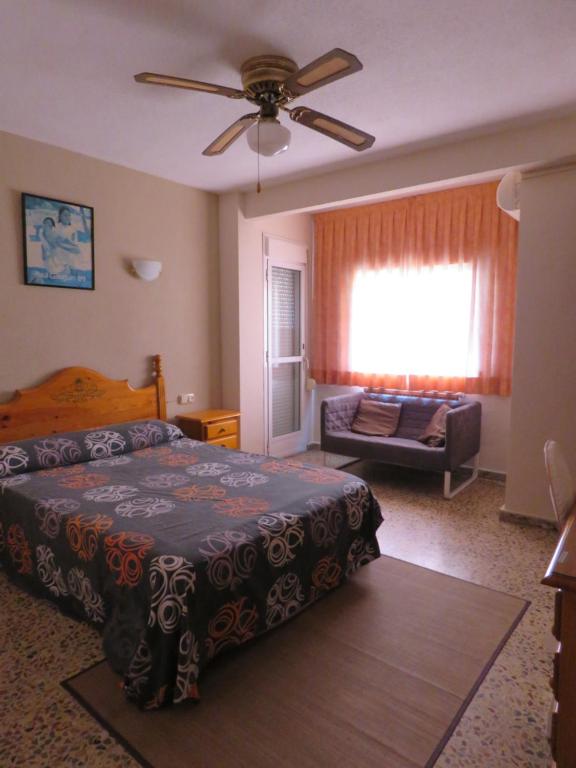Postel nebo postele na pokoji v ubytování Hotel Alain