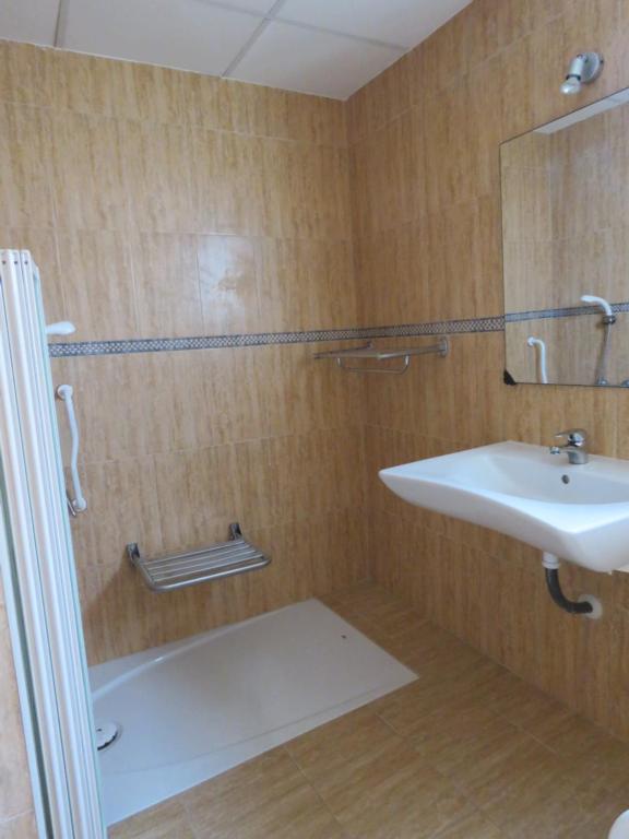 Koupelna v ubytování Hotel Alain