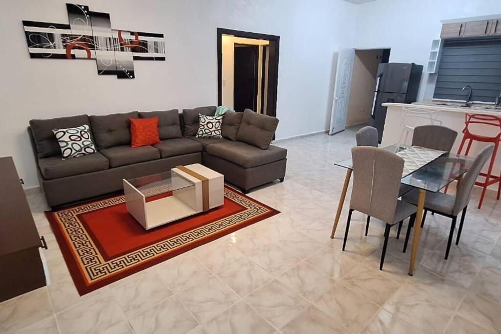 a living room with a couch and a table at Apartamento Céntrico en Cabrera in Cabrera
