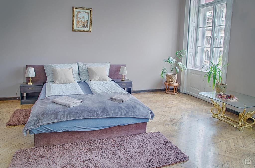 Llit o llits en una habitació de Basilica Apartment