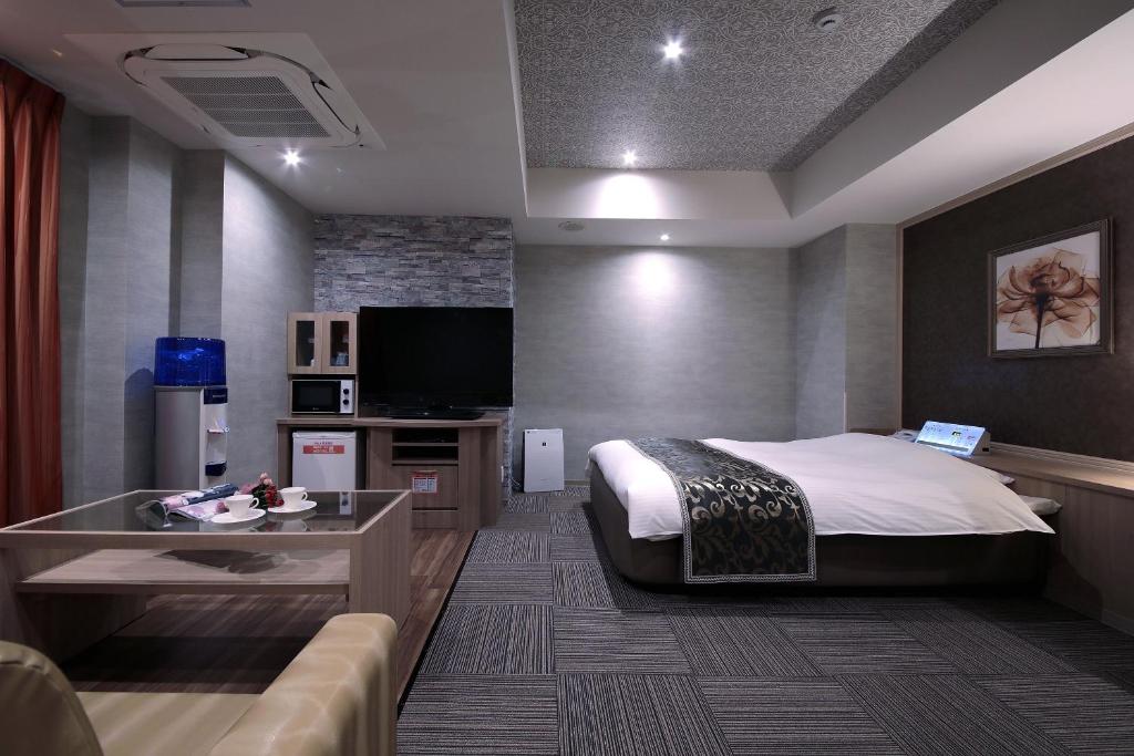 TV a/nebo společenská místnost v ubytování M'z HOTEL