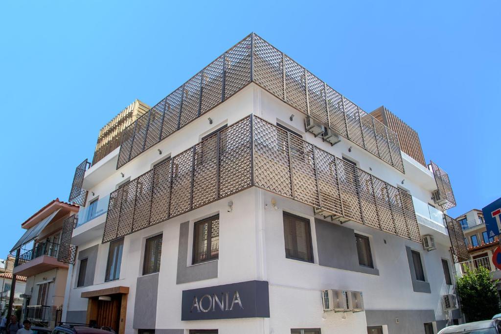 a building with a roof on top of it at Aonia Luxurious Modern Boutique Apartments in Chalkida