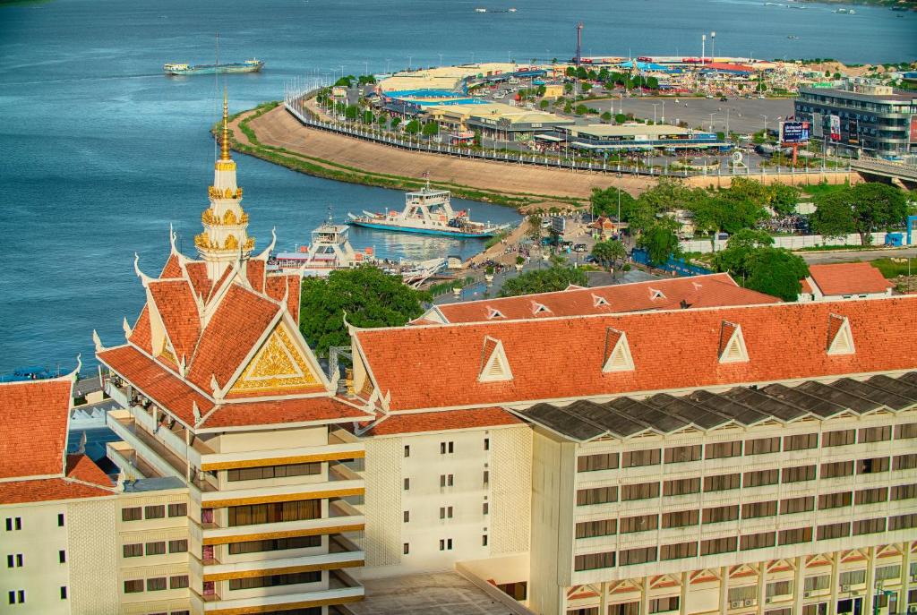 an aerial view of a building and the ocean at Hotel Cambodiana in Phnom Penh