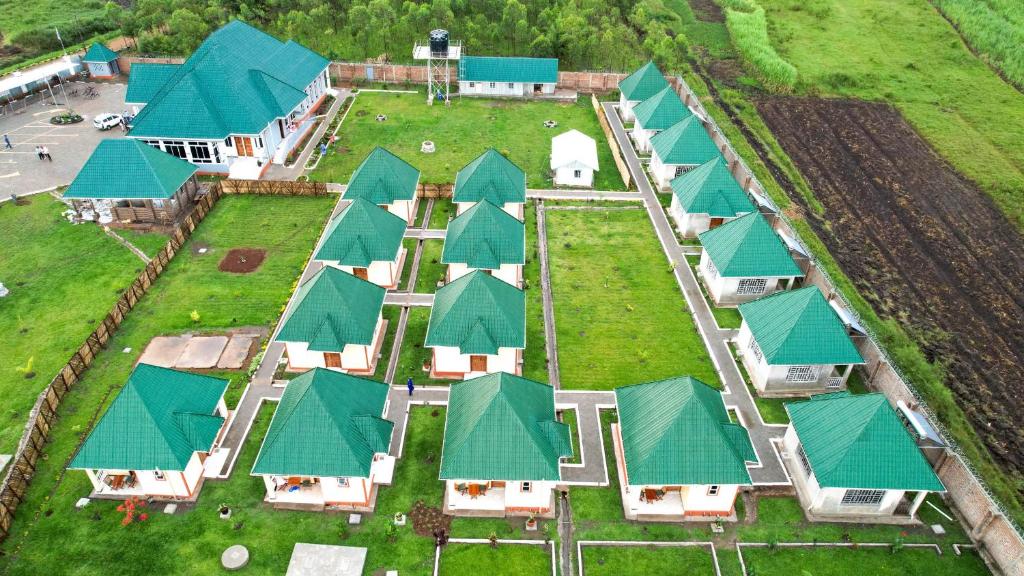 an overhead view of a row of houses with green roofs at Grace Resort in Homa Bay
