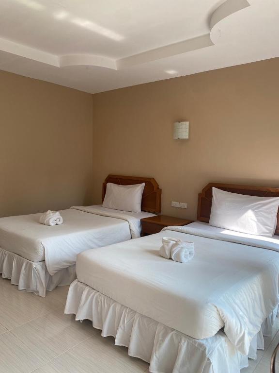 Кровать или кровати в номере Garden View Resort Tonsai