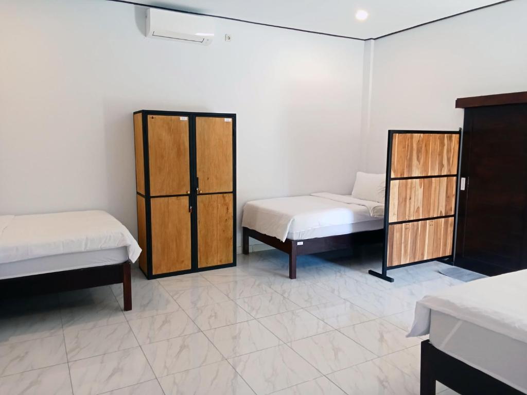 Posteľ alebo postele v izbe v ubytovaní Scuba Tribe Bali dive-resort