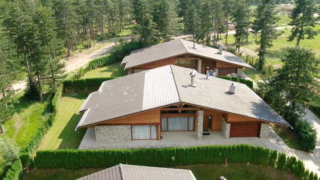 an overhead view of a house with a roof at Villa Katerina Deluxe - Pirin Golf and Country Club in Bansko