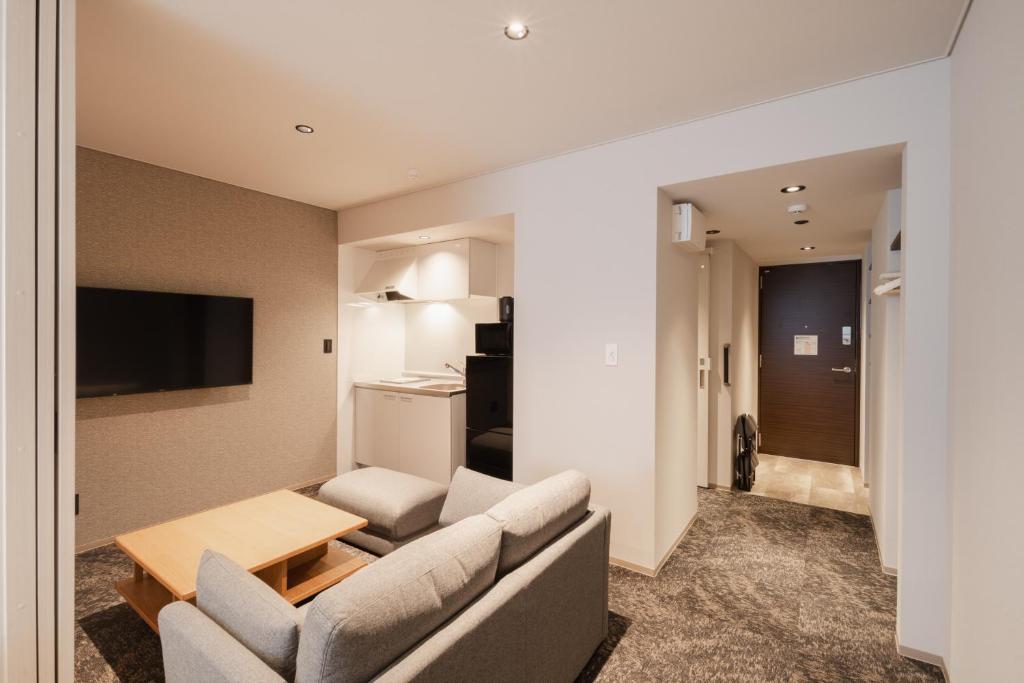 TV a/nebo společenská místnost v ubytování Hotel Ninestates Kagoshima