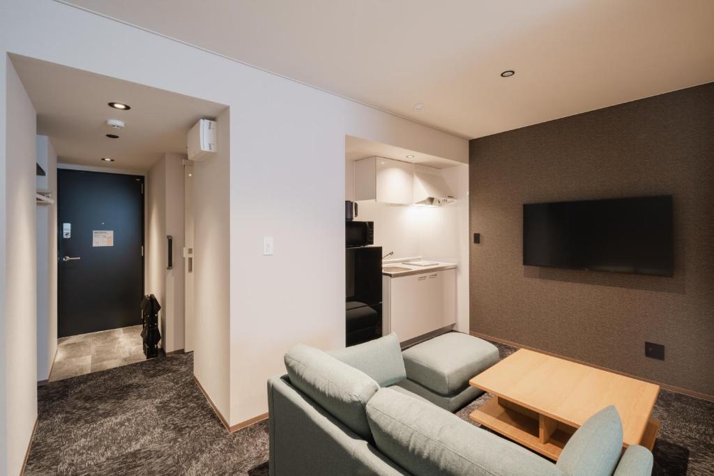 TV a/nebo společenská místnost v ubytování Hotel Ninestates Kagoshima