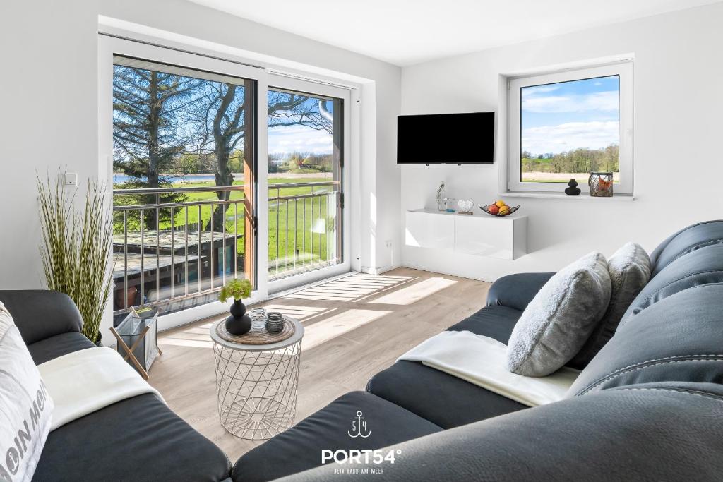 Televiisor ja/või meelelahutuskeskus majutusasutuses Ferienwohnung Winningmay II Füsing