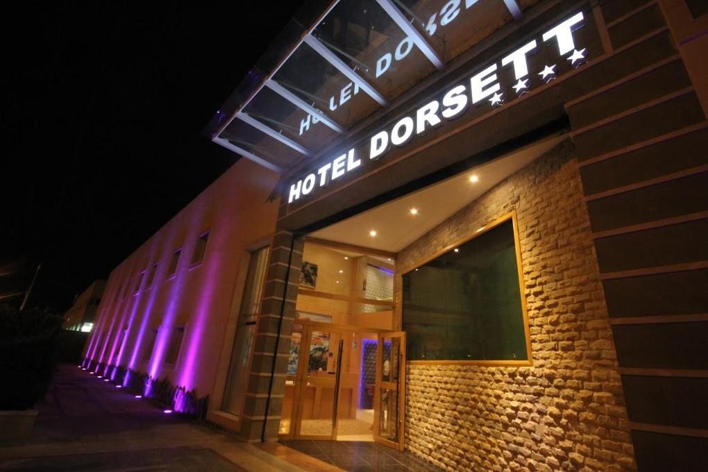 a building with purple lights on the side of it at Menoir Dorsett Madrid Leganés in Leganés