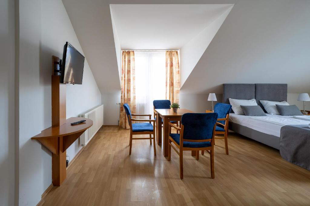 Postel nebo postele na pokoji v ubytování Hotel Forrás Zalakaros