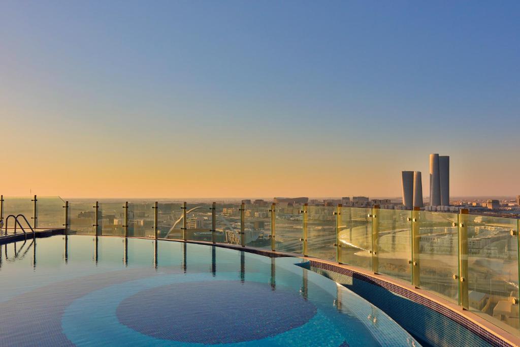 a large swimming pool on the top of a building at J 22 Residence in Lusail