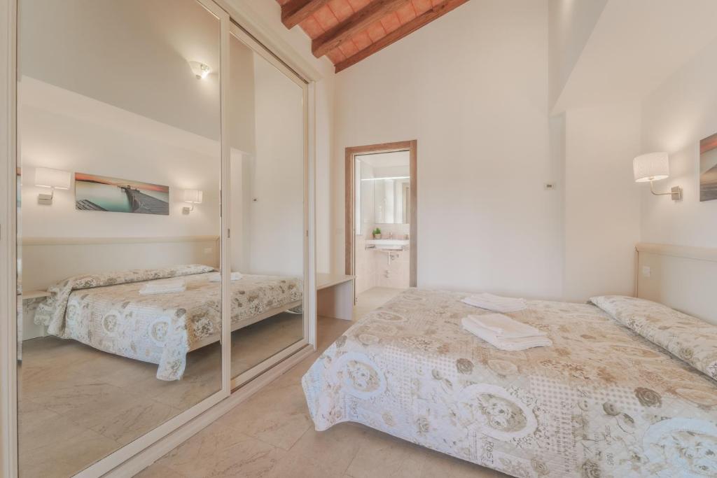 Postel nebo postele na pokoji v ubytování Villa Mia