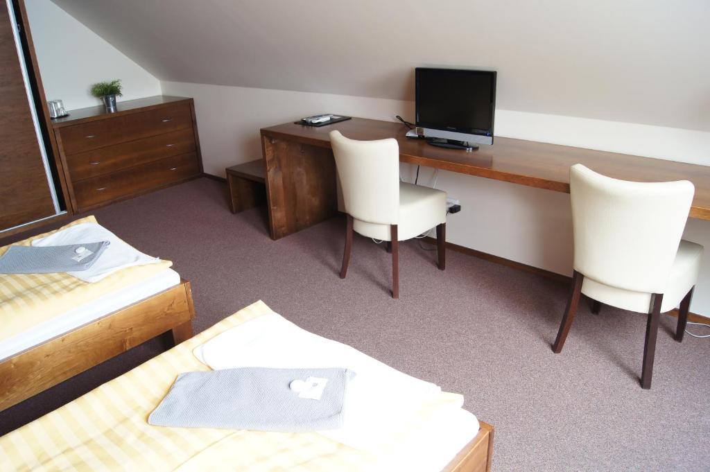 Telewizja i/lub zestaw kina domowego w obiekcie Pension Inspirace a Wellness self check-in