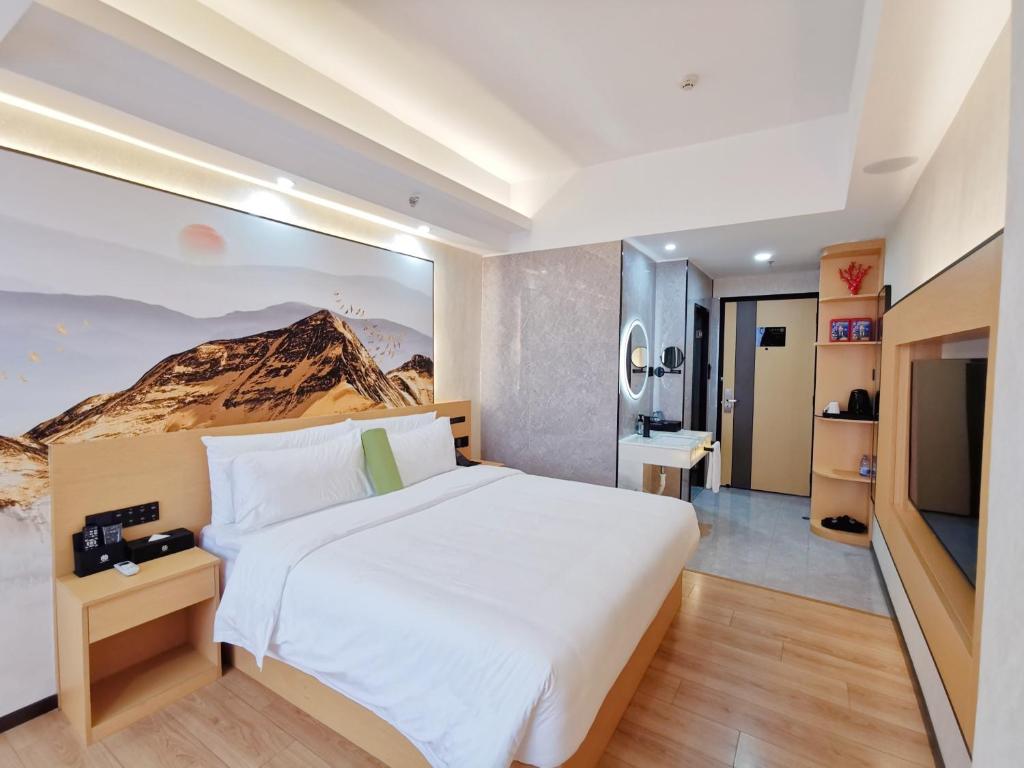Postel nebo postele na pokoji v ubytování Connar Hotel - Shenzhen Shawei