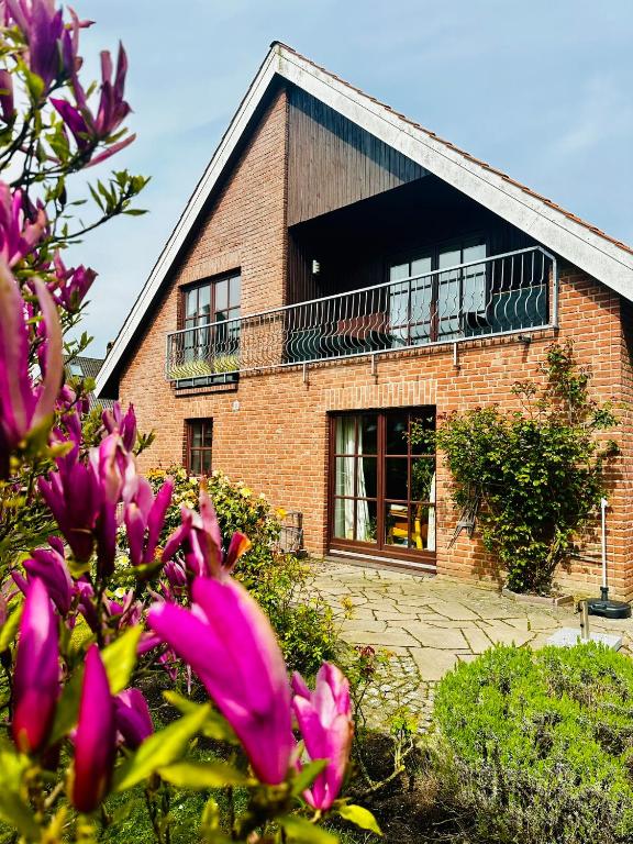 Zahrada ubytování Große deluxe Ferienwohnung mit Balkon, 2 SZ und nur 300m zum Strand