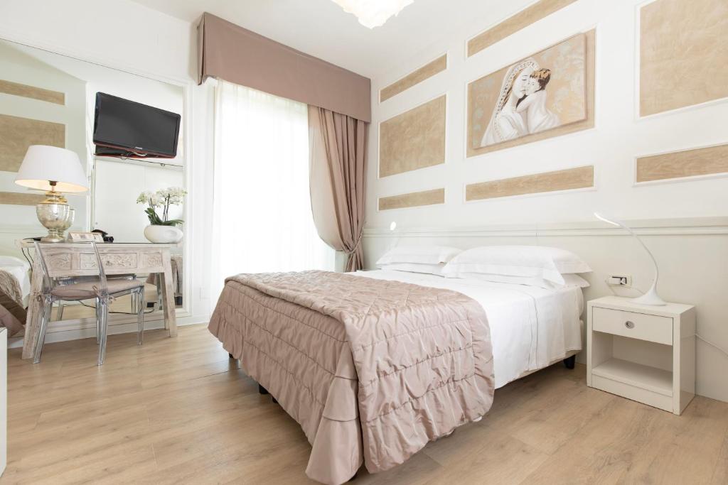 Postel nebo postele na pokoji v ubytování Hotel Alexander