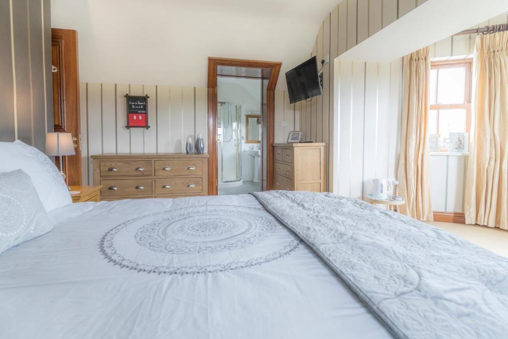 Postel nebo postele na pokoji v ubytování Glenvela guest house
