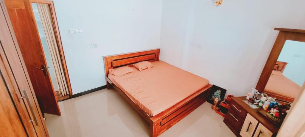Godamuduna Village Villa tesisinde bir odada yatak veya yataklar