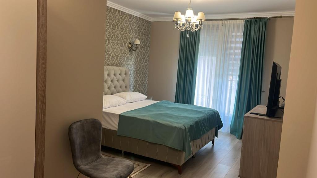 Postel nebo postele na pokoji v ubytování Live Tulcea Hotel