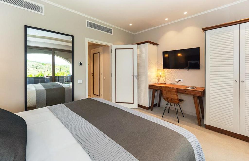 TV a/nebo společenská místnost v ubytování Bella Mare Hotel