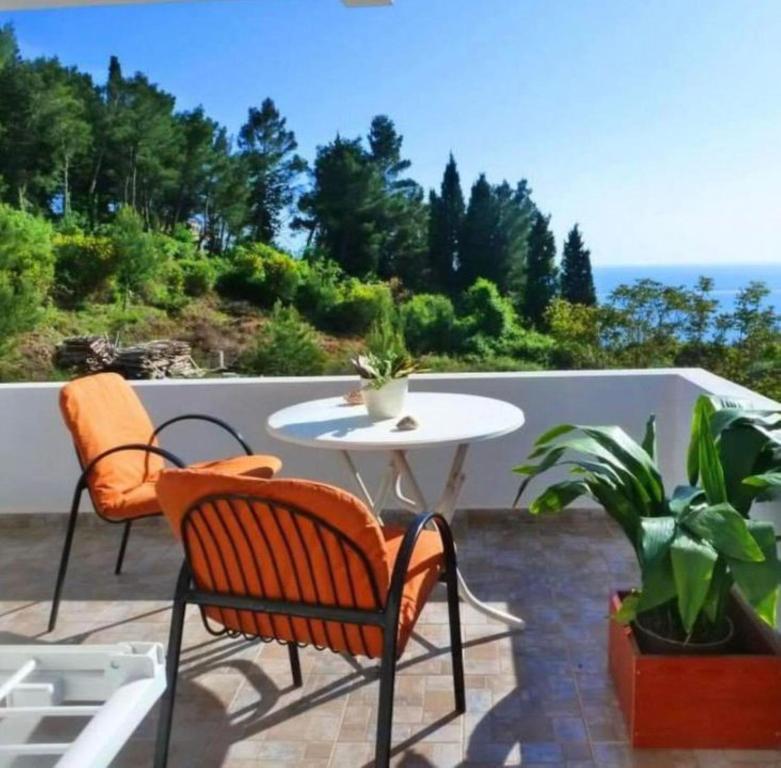 a patio with two chairs and a table on a patio at Apartments Lungo Mare Ulcinj in Ulcinj
