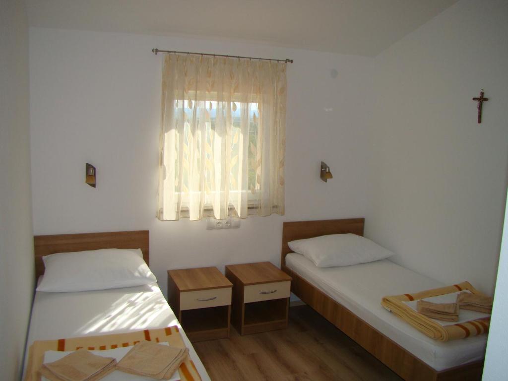 Postel nebo postele na pokoji v ubytování Pansion Ivan