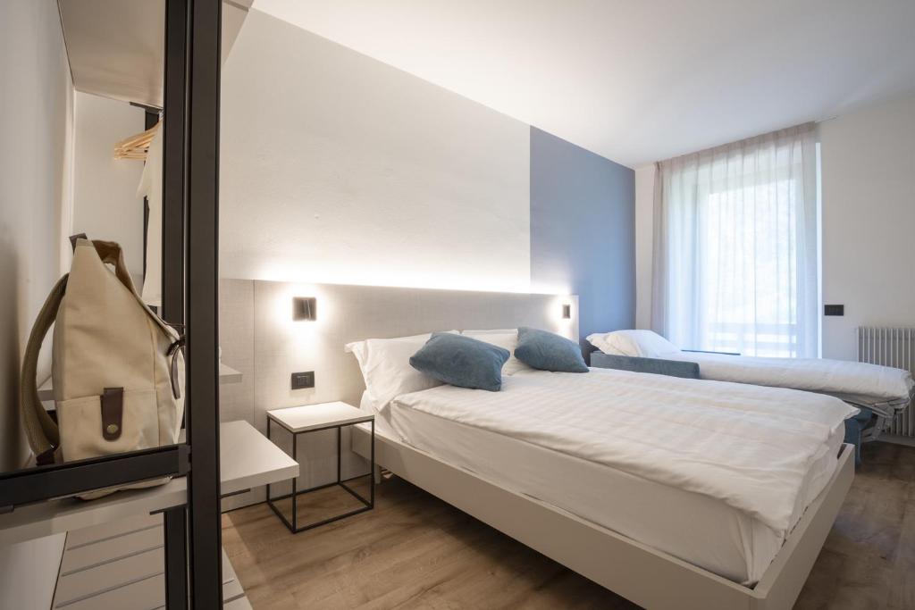 Łóżko lub łóżka w pokoju w obiekcie Villa Stanga - Gardaslowemotion