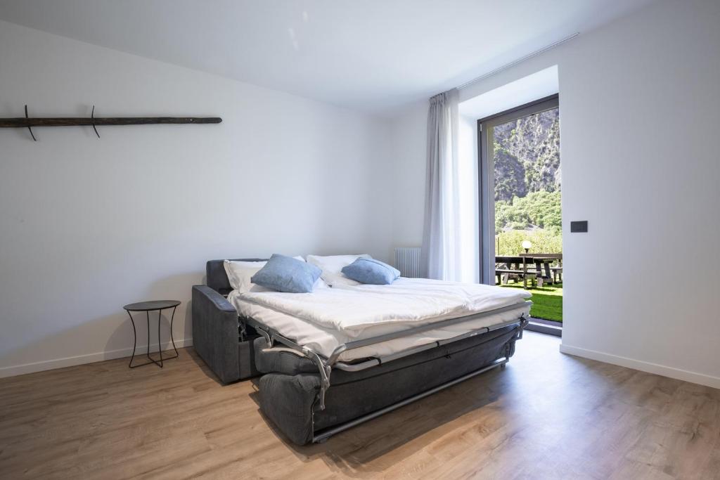 Łóżko lub łóżka w pokoju w obiekcie Villa Stanga - Gardaslowemotion