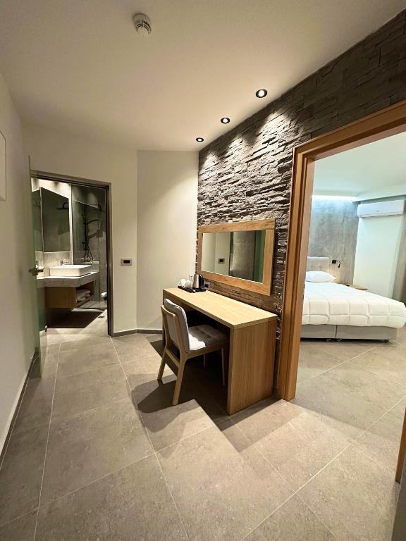 Postel nebo postele na pokoji v ubytování Argiri Resort Hotel & Apartments
