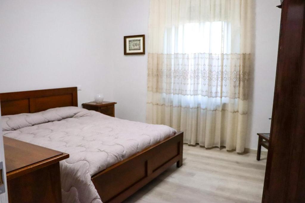 מיטה או מיטות בחדר ב-La Casa di Piccolì - APPARTAMENTO