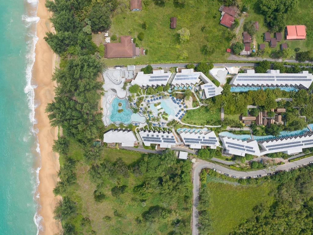 an aerial view of a resort next to a beach at Le Méridien Phuket Mai Khao Beach Resort in Mai Khao Beach