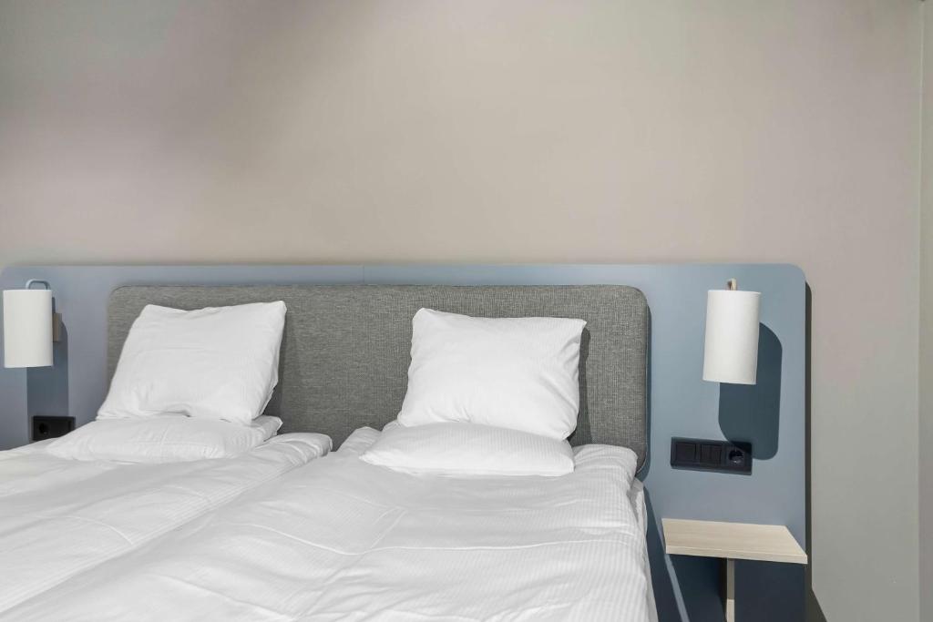 Postel nebo postele na pokoji v ubytování Aiden by Best Western Karlstad Arena