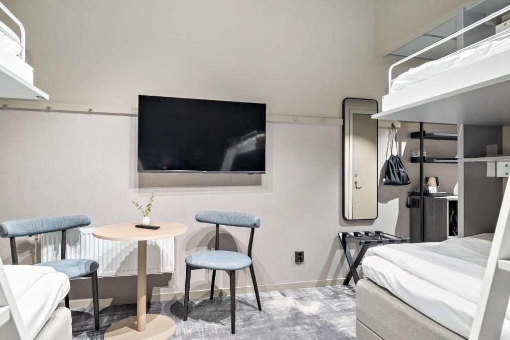 Postel nebo postele na pokoji v ubytování Aiden by Best Western Karlstad Arena