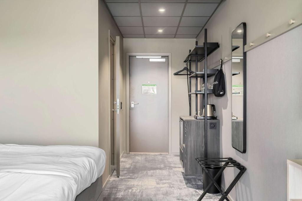 Postel nebo postele na pokoji v ubytování Aiden by Best Western Karlstad Arena